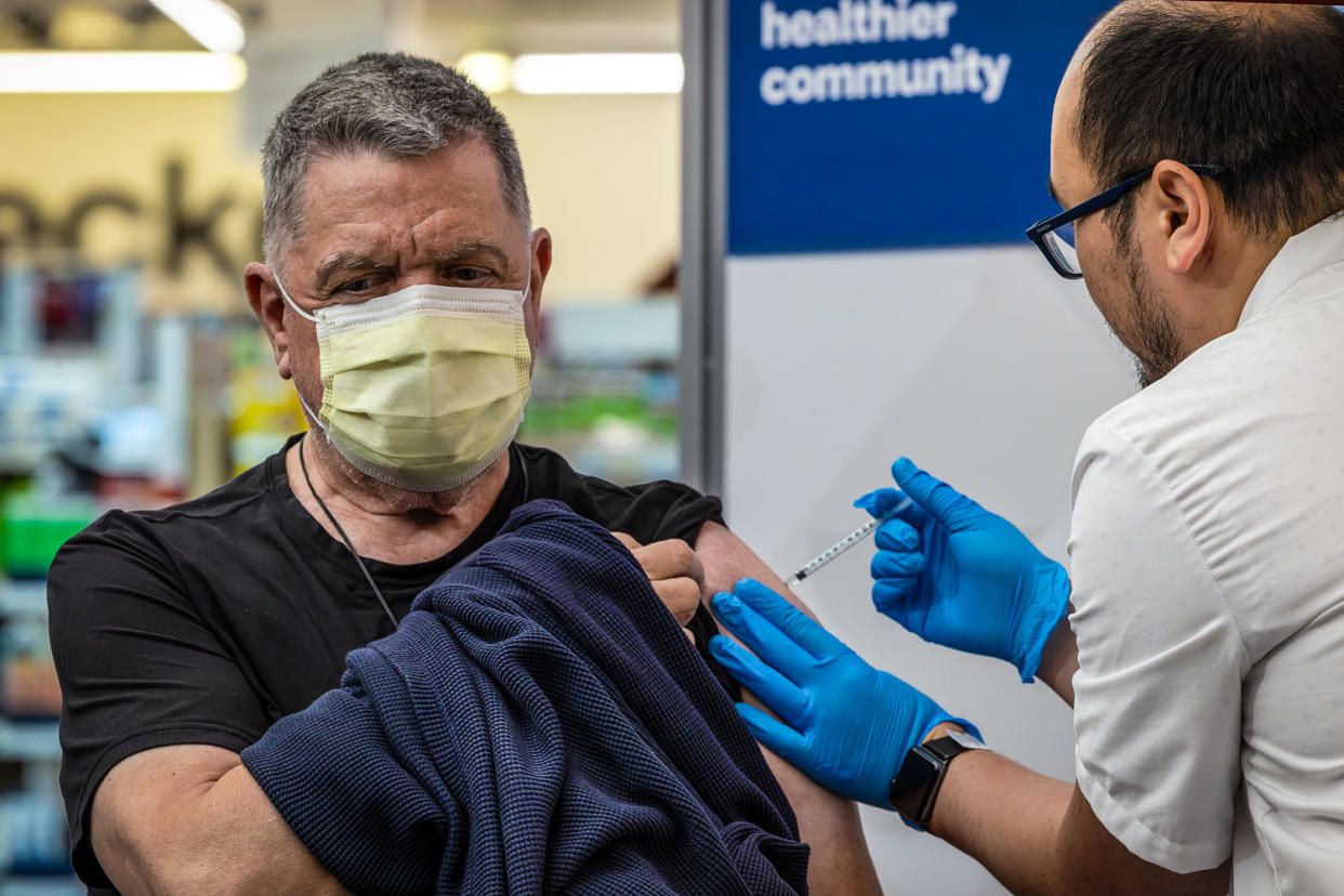 A pharmacist administers a new mRNA Covid vaccine COMIRNATY by Pfizer at CVS Pharmacy in Eagle Rock, Calif., on Sept. 14, 2023. (Irfan Khan / Los Angeles Times via Getty Images)