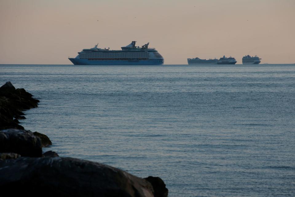 FILE PHOTO: A group of cruise ships are anchored in Manila Bay as its crew members undergo quarantine amid the coronavirus disease (COVID-19) outbreak, in Manila, Philippines, May 8, 2020. Picture taken May 8, 2020. REUTERS/Eloisa Lopez/File Photo