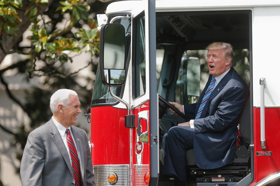 <p>President Trump, accompanied by Vice President Mike Pence, sits inside a cabin of a firetruck during a “Made in America,” product showcase featuring items created in each of the U.S. 50 states, Monday, July 17, 2017, on the South Lawn of the White House in Washington. (AP Photo/Pablo Martinez Monsivais) </p>