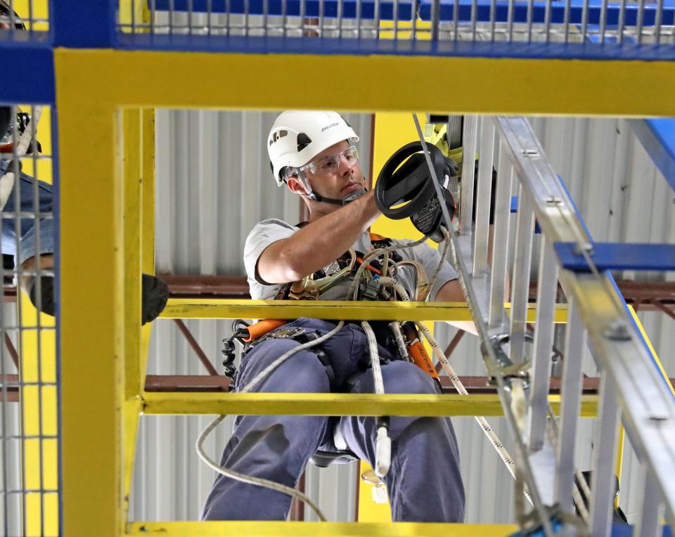 Todd Kudas, wind farm trainee, works through the rescue training exercise Wednesday, July 21, 2021, at the Arcon Training Center in Salisbury, Maryland.