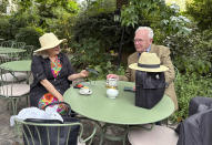 Gillian Levison and Richard Mitchell, visitors to Paris from Dorset, England, chat at their hotel on the Left Bank, Thursday, July 25, 2024, in Paris, France. (AP Photo/Jocelyn Noveck)