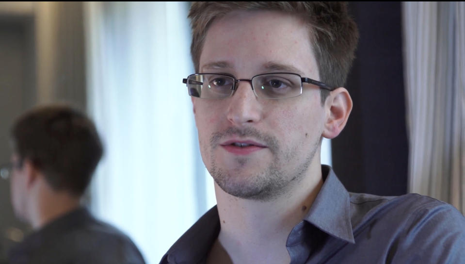 This photo provided by The Guardian Newspaper in London shows Edward Snowden, who worked as a contract employee at the National Security Agency, June 9, 2013, in Hong Kong. U.S. intelligence officials are planning an electronic monitoring system that would tap into government, financial and public databases to scan the behavior patterns of many of the 5 million government employees who hold secret clearances, according to current and former officials. The system draws on a Defense Department model in development for more than a decade, documents reviewed by the Associated Press show. (AP Photo/The Guardian, Glenn Greenwald and Laura Poitras)