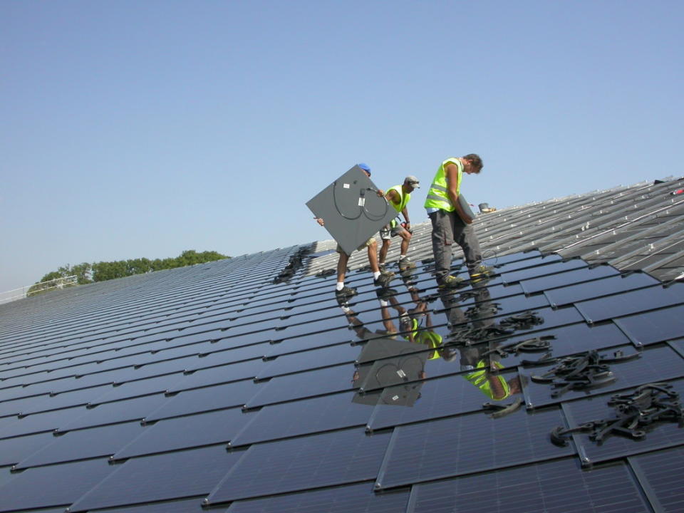 Crews install these solar tiles.<p>CertainTeed</p>