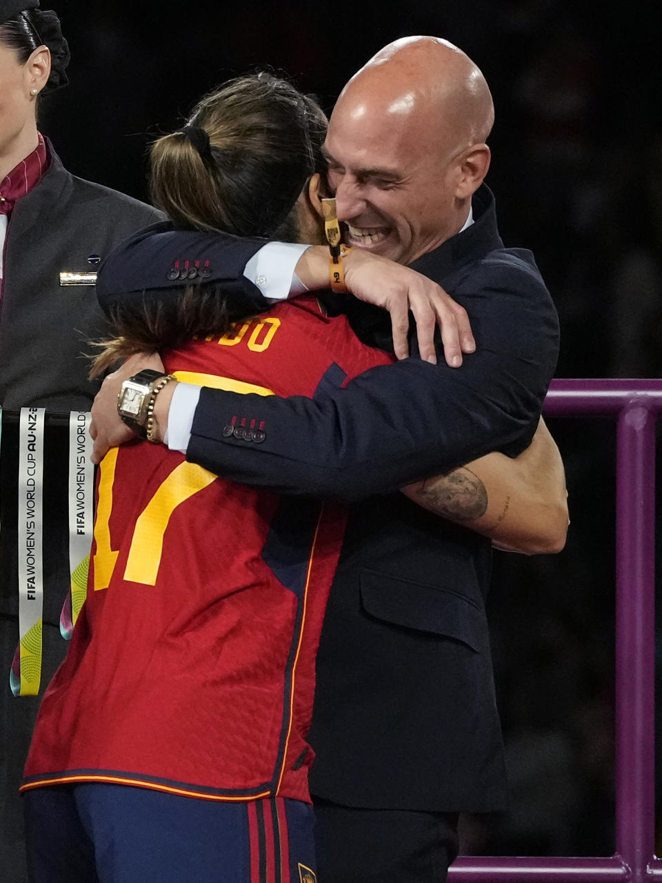 FILE - President of Spain's soccer federation Luis Rubiales embraces Alba Redondo during the awards ceremony for the Women's World Cup soccer final at Stadium Australia in Sydney, Australia, Sunday, Aug. 20, 2023. Spain defeated England in the final. Spain faces reckoning over sexism in soccer after federation head kisses player at Women's World Cup. (AP Photo/Rick Rycroft, File)