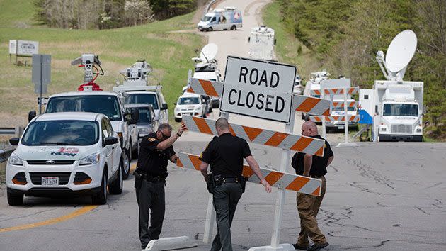 Authorities set up road blocks at the intersection of Union Hill Road and Route 32 at the perimeter of a crime scene. Photo: AP