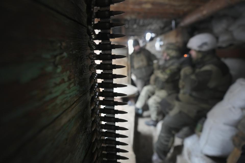 Ukrainian servicemen rest in a shelter on the front line in the Luhansk region, eastern Ukraine, Friday, Jan. 28, 2022. High-stakes diplomacy continued on Friday in a bid to avert a war in Eastern Europe. The urgent efforts come as 100,000 Russian troops are massed near Ukraine's border and the Biden administration worries that Russian President Vladimir Putin will mount some sort of invasion within weeks. (AP Photo/Vadim Ghirda)