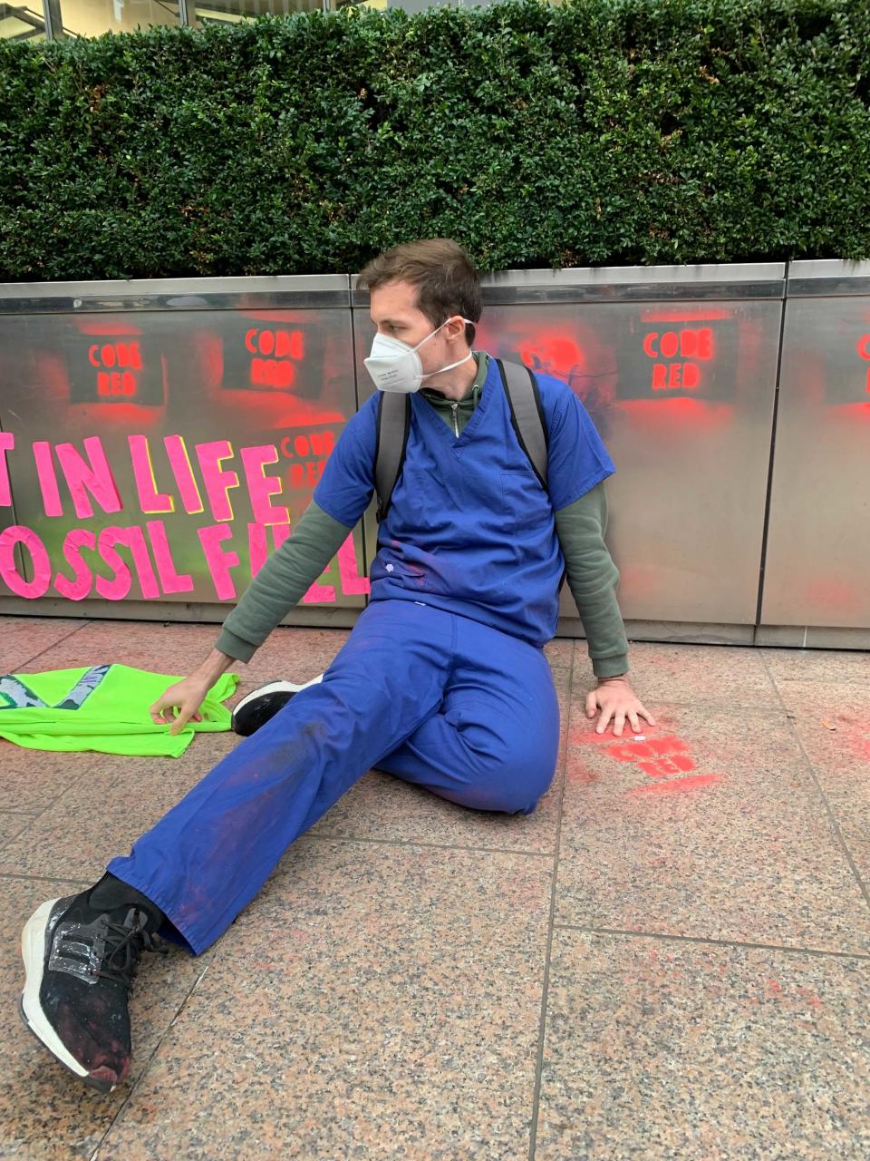 Protesters glued their hands to the floor or to flower boxes (The Independent)