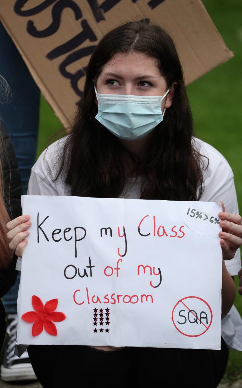 Teenagers protested at the system on Friday - Andrew Milligan/PA