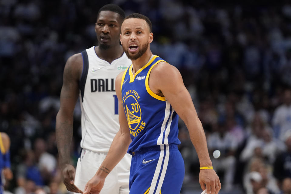 Golden State Warriors guard Stephen Curry yells at an official downcourt during the first half of Game 4 of the NBA basketball playoffs Western Conference finals against the Dallas Mavericks, Tuesday, May 24, 2022, in Dallas. (AP Photo/Tony Gutierrez)