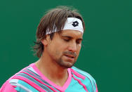 David Ferrer of Spain loses a point to Stanislas Wawrinka of Switzerland during their semifinal match of the Monte Carlo Tennis Masters tournament in Monaco, Saturday April 19, 2014. Wawrinka won 6-1, 7-6. (AP Photo/Claude Paris)