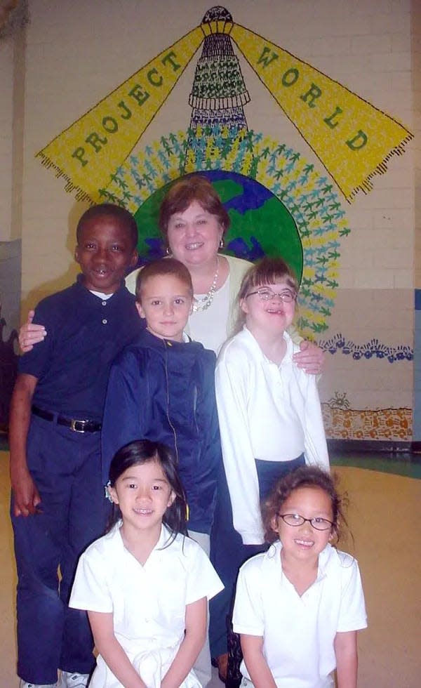 Marshpoint Elementary Principal Cindi Kobleur with some of her students in this file photo.