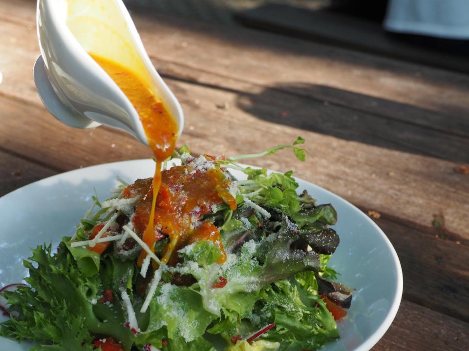 Vegetable salad and salad dressing.