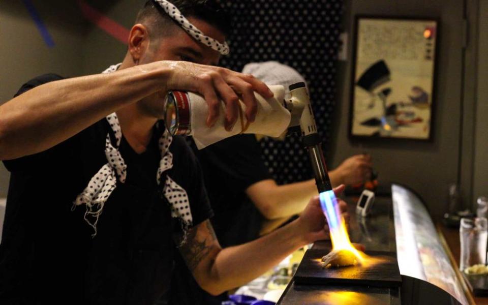 Chef David Bouhadana prepares a dish for the 12-piece omakase at Sushi by Bou at Sanctuary Hotel.