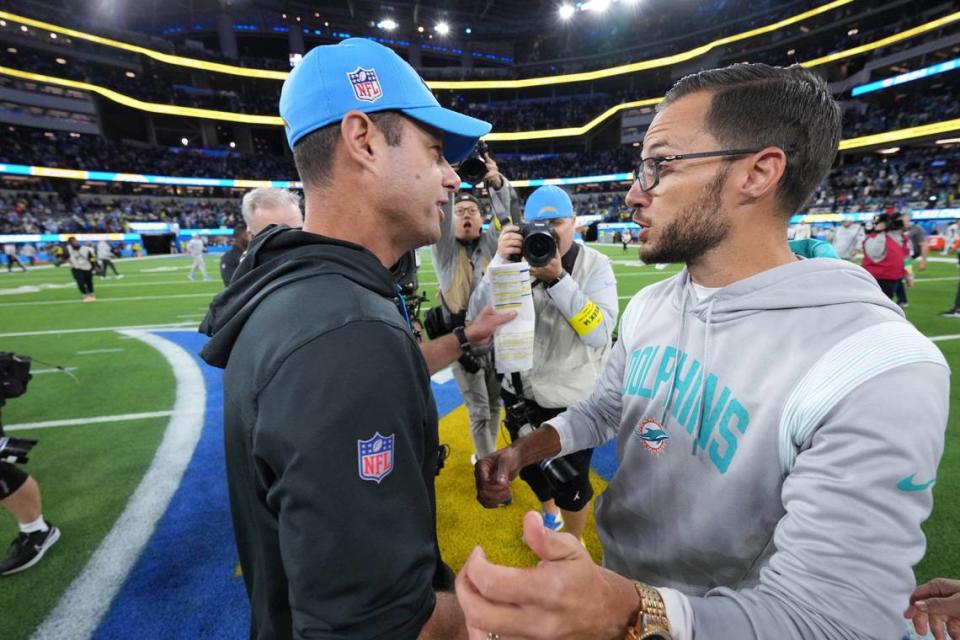 Dec 11, 2022; Inglewood, California, USA; Los Angeles Chargers head coach Brandon Staley and Miami Dolphins head coach Mike McDaniel shake hands after the game at SoFi Stadium. Mandatory Credit: Kirby Lee-USA TODAY Sports