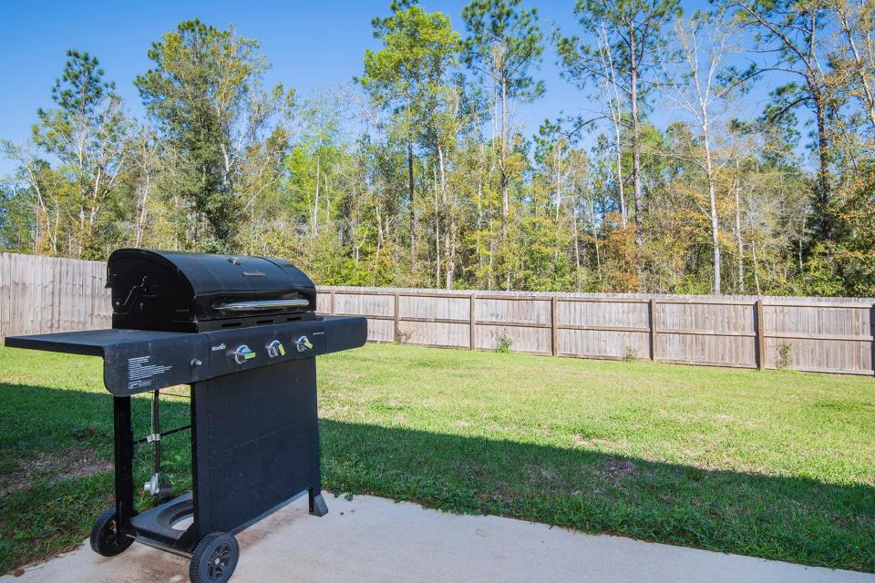 Barbecues will be a hit in the privacy-fenced backyard.