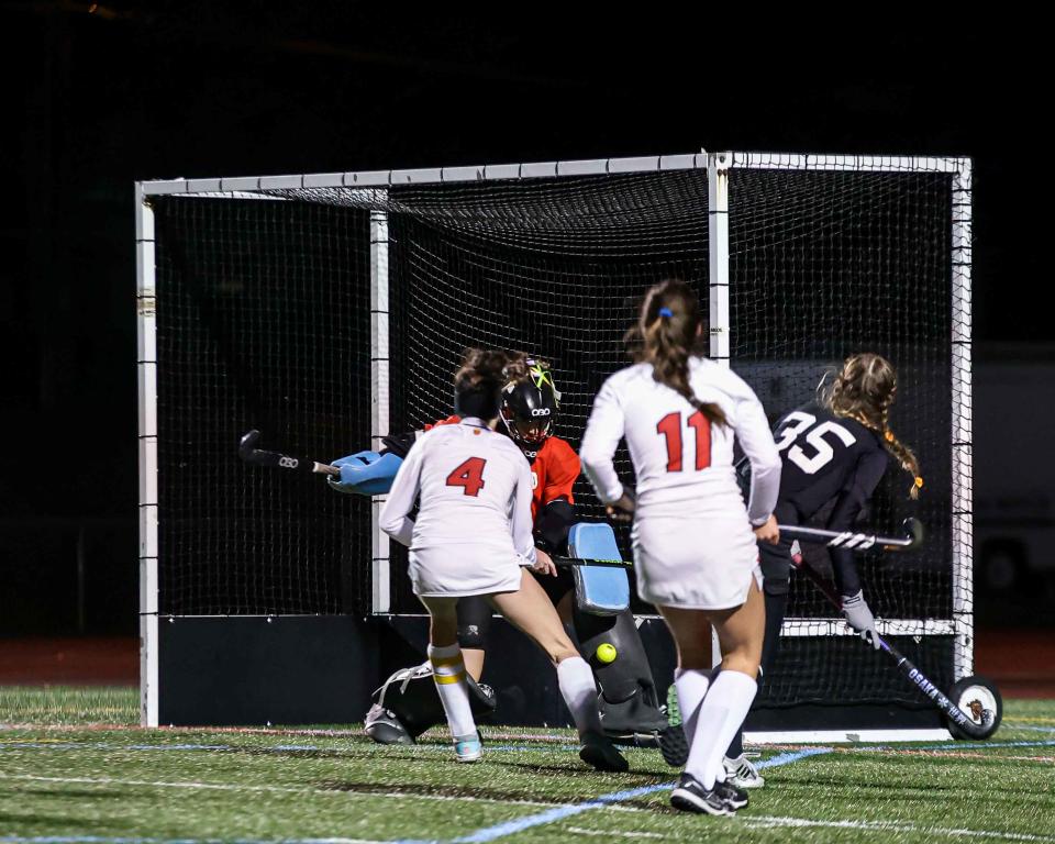 Palmyra's Avery Russell (35) fires a shot that gets saved by Monarch goal keeper Lilly Sweeney (88) during a PIAA Class 2A State Semi-final Field Hockey game between Gwynedd Mercy and Palmyra. Wednesday November 16, 2022 held at Governor Mifflin High School Shillington PA. The Palmyra Cougars defeated the Gwynedd Mercy Monarchs 3-1 to advance to the PIAA State Championship game vs Mechanicsburg.