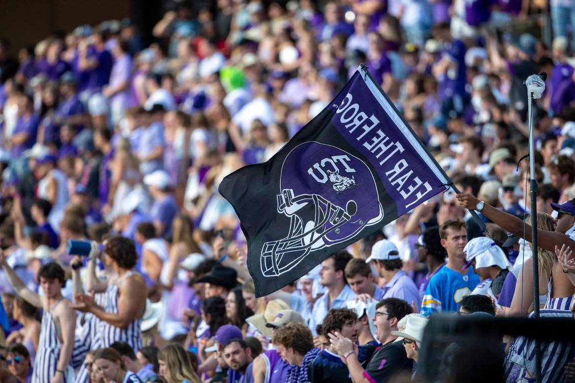 TCU fans wave a flag in support of their team during their game against OSU at the Amon G. Carter Stadium in Fort Worth on Saturday, Oct. 15, 2022. The final score was 43-40.