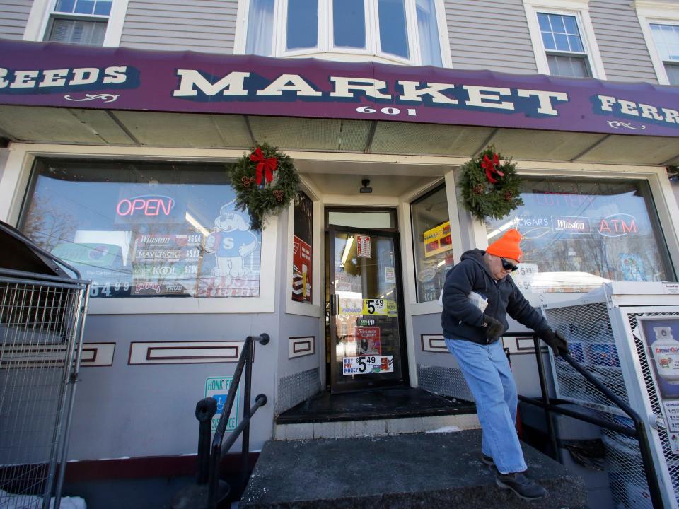 A customer departs Reeds Ferry Market convenience store on January 7, 2018, in Merrimack, New Hampshire, the location that sold the winning ticket