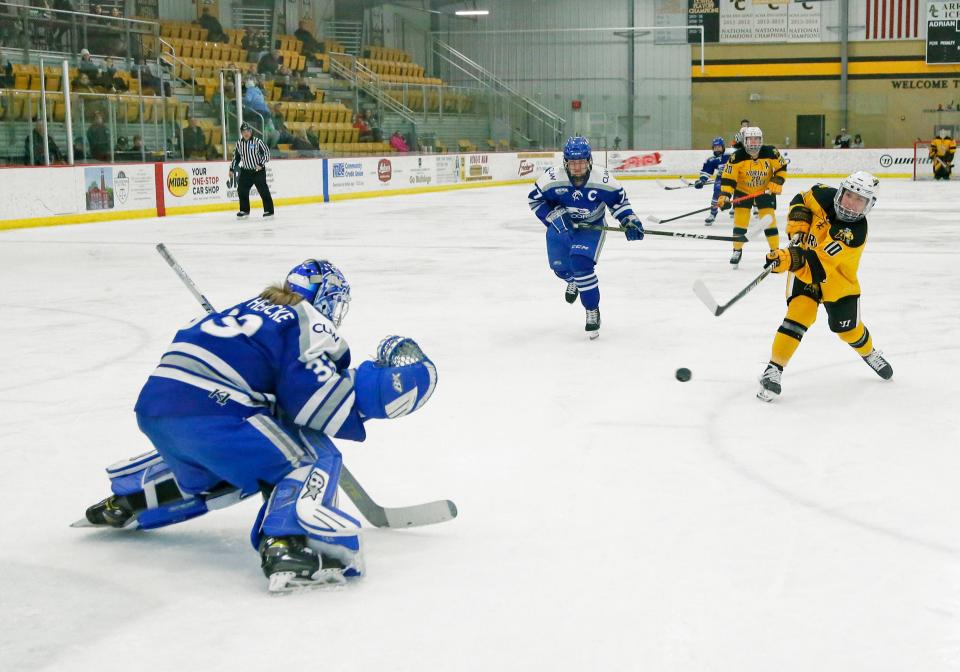 Adrian College’s Kathryn Truban scores on Concordia, Wisc., goalkeeper Annalina Van Hercke Saturday night.