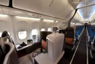 A view of the business cabin, with the economy cabin seen in the background, during Singapore Airlines' media preview of their new Boeing 737-8 cabin products, at Changi Airport in Singapore