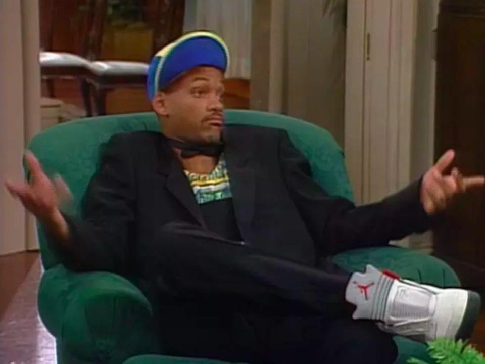 will smith sitting in green chair on set of the fresh prince of bel air