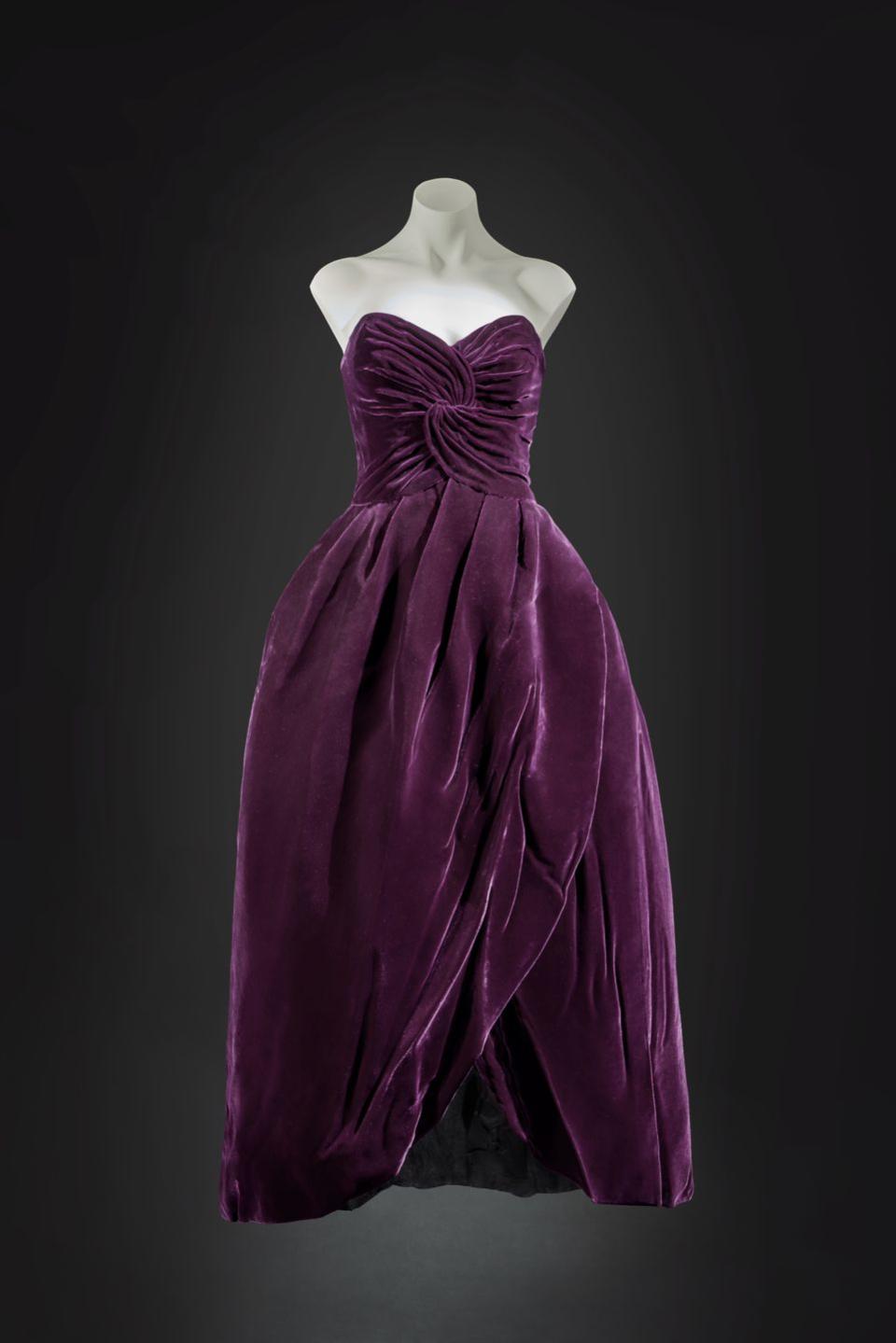 princess diana the ball dress of deep aubergine silk velvet with a tulipshaped stiffened skirt augmented by three paste buttons at the back was designed by society dressmaker victor edelstein