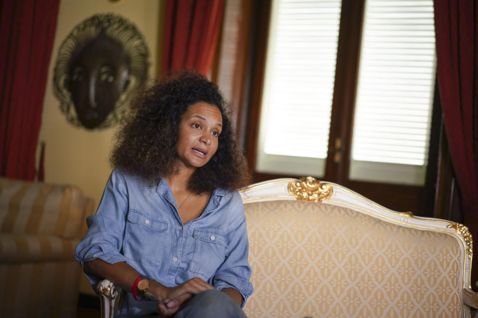 Fashion designer Stella Jean talks during an interview with the Associated Press, in Rome, Thursday, Aug. 13, 2020. Stella Jean, a Haitian-Italian designer born and raised in Rome, launched her appeal this summer. She asked the Italian National Fashion Chamber and the global powerhouses steering it, including Prada, Ferragamo and Zegna, to back their social media pledges supporting the Black Lives Matter movement with concrete, transparent commitments toward greater racial diversity. (AP Photo/Andrew Medichini)