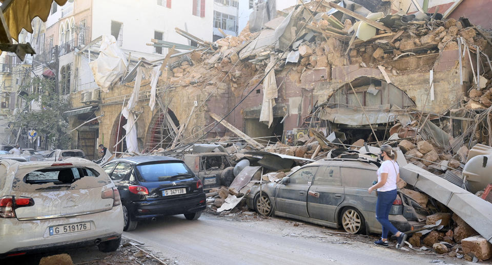 Damaged buildings and vehicles in the aftermath of a massive explosion in Beirut, Lebanon.