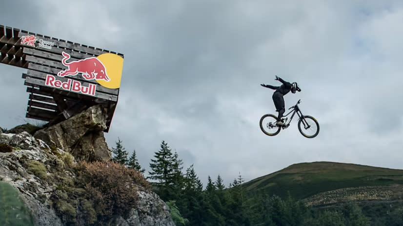 Rider doing a suicide on the road gap at Red Bull Hardline