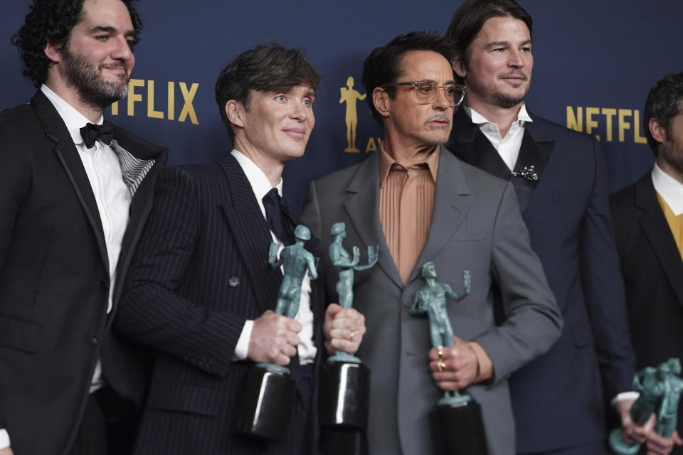 Benny Safdie, from left, Cillian Murphy, Robert Downey Jr., and Josh Hartnett, winners of the award for the award for outstanding performance by a cast in a motion picture for "Oppenheimer," pose in the press room during the 30th annual Screen Actors Guild Awards on Saturday, Feb. 24, 2024, at the Shrine Auditorium in Los Angeles. (Photo by Jordan Strauss/Invision/AP)