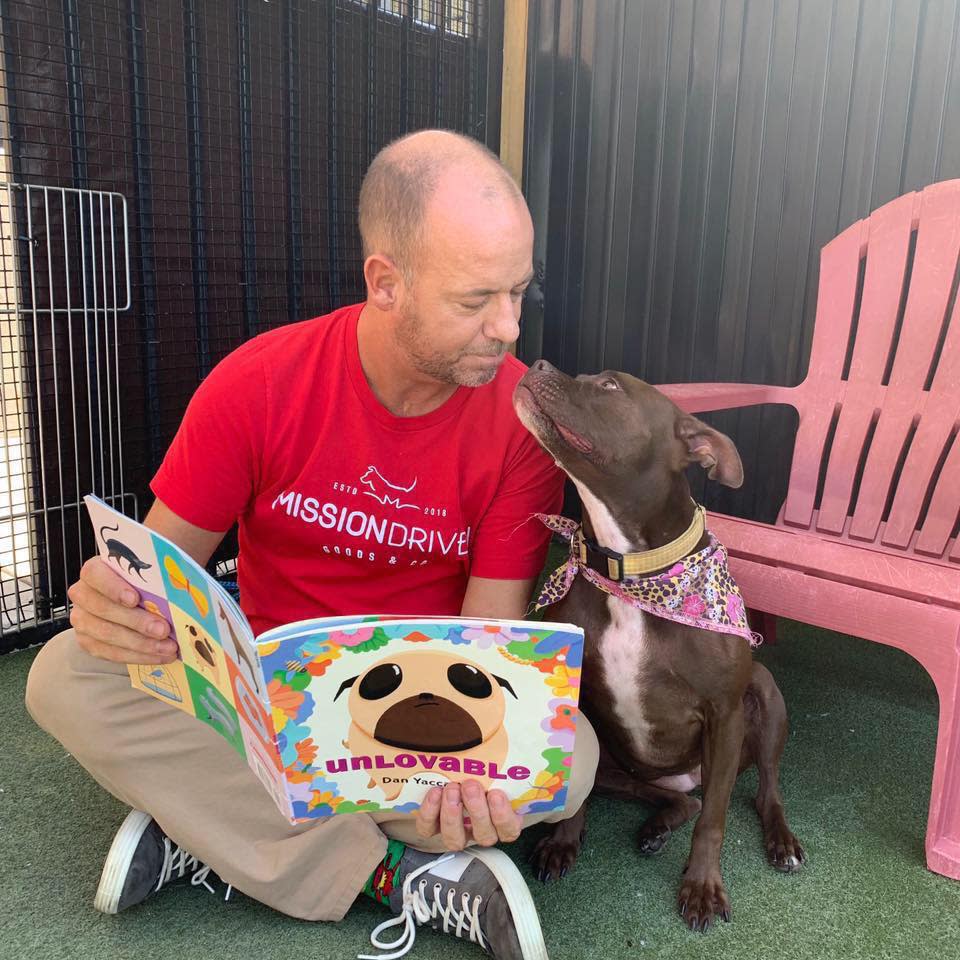 Scott Poore, a Kansas City animal advocate, has moved into his local animal shelter to help find a dog named Queen a forever home. (Credit: Scott Poore)