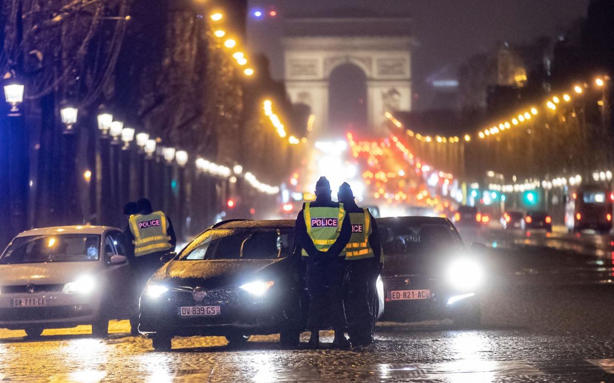 Police ask drivers and pedestrians to show valid reasons for being out during curfew - IAN LANGSDON/EPA-EFE/Shutterstock