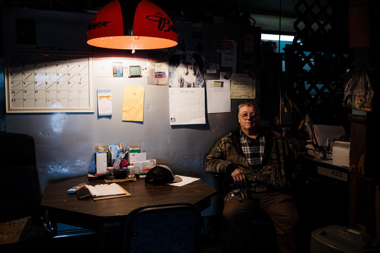 Plant operator Jim Edens sits in his command center for the water district lnside his personal business, Jim's Place, in Whippoorwill, Okla.