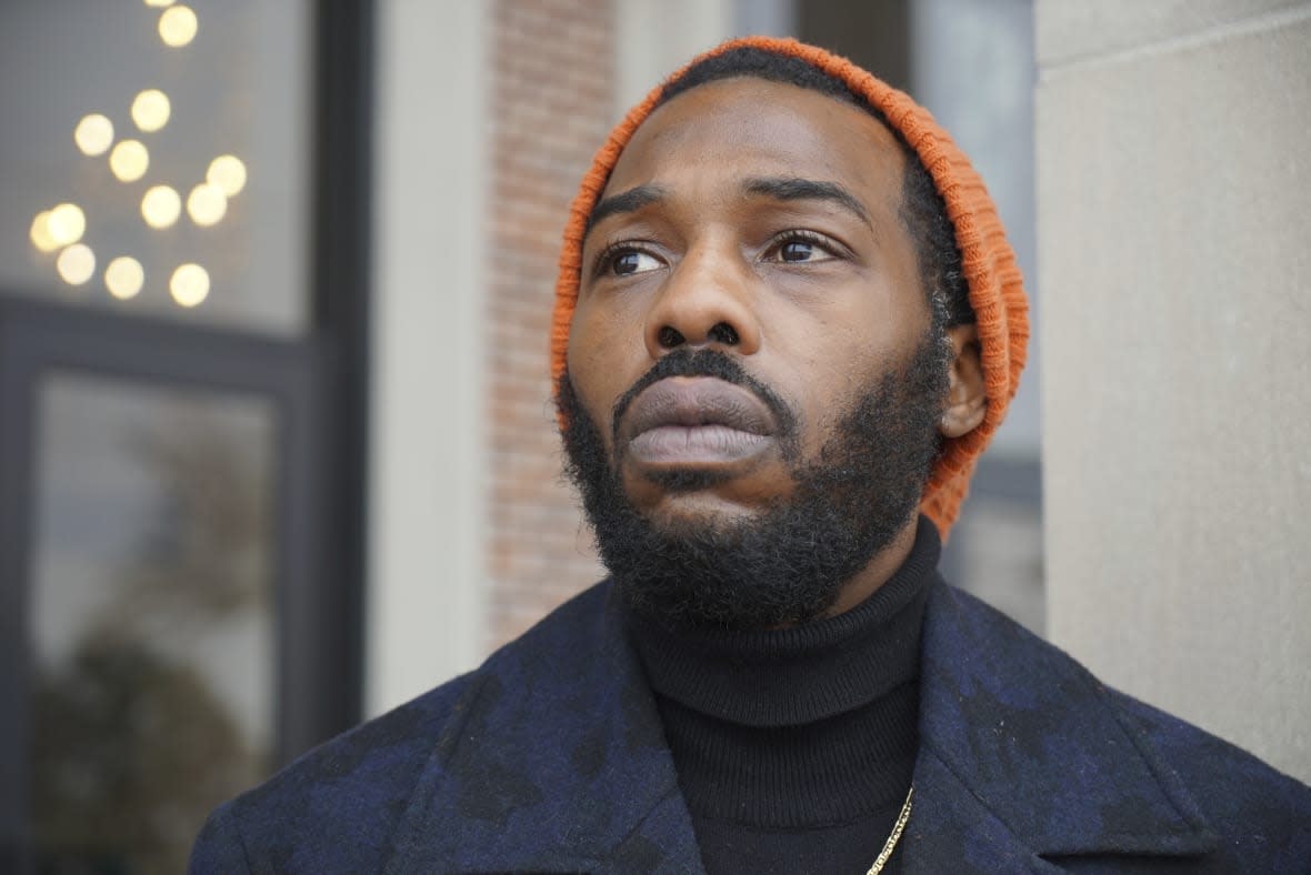 Community organizer Chase Madkins stands on the porch of the Mississippi Boulevard Christian Church in Memphis, Tenn., on Wednesday, Feb. 1, 2023. Madkins attended the funeral of Tyre Nichols, who died of injuries following a traffic stop by Memphis Police. (AP Photo/Allen G. Breed)