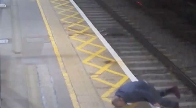 Derek Acton can be seen clambering down onto the tracks. Source: BTP