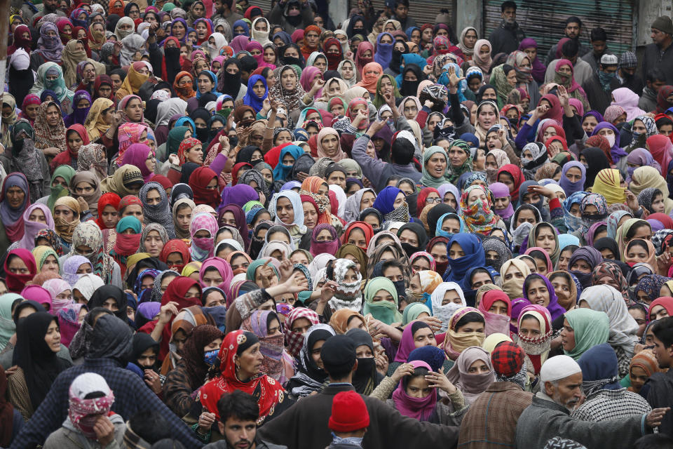 Kashmiri villagers attend the joint funeral of teenage rebels