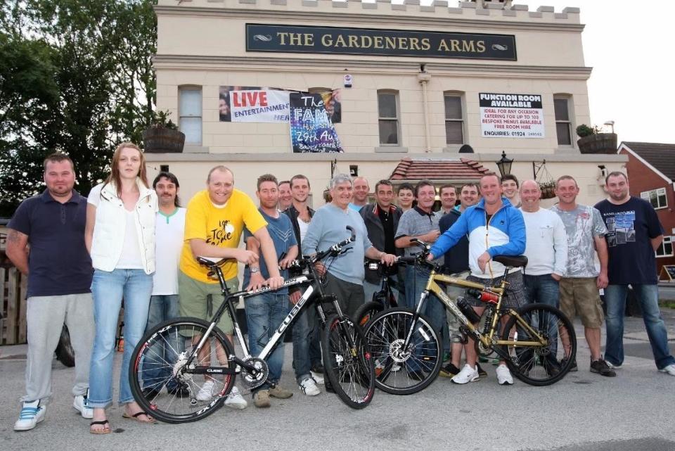 Staff and Regulars at the Gardeners Arms in Crigglestone raised thousands of pounds for Wakefield Hospice, which iincluded a bike ride to Scarborough. With Terry Rigg from Wakefield Hospice (Photo: s)