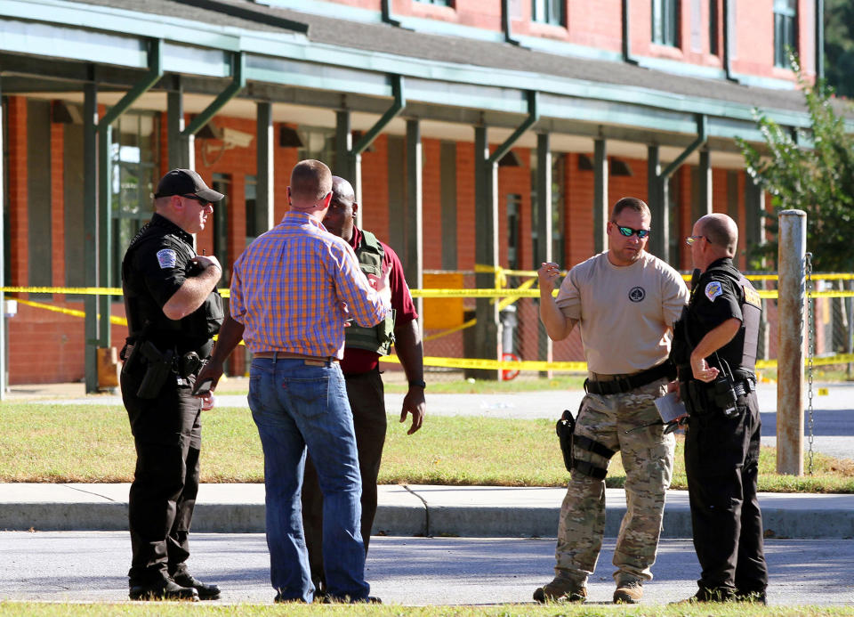 <p>Anderson County sheriff’s deputies and investigators gather outside of Townville Elementary School after a shooting in Townville, S.C., on Sept. 28, 2016. (Nathan Gray/Reuters) </p>