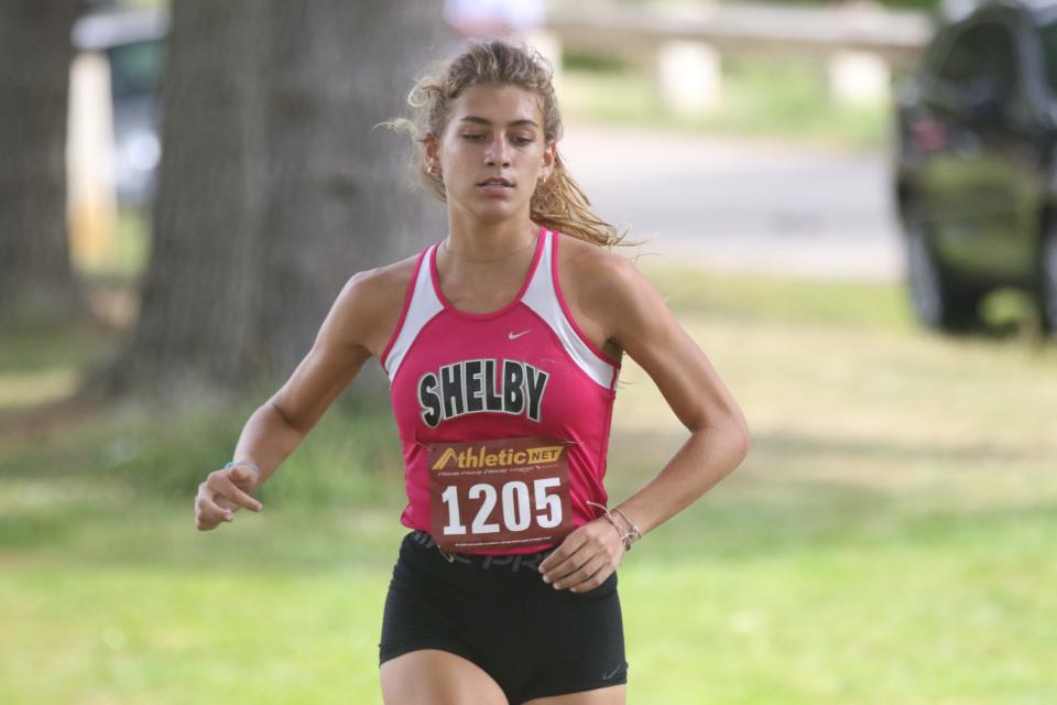 Shelby's Kayla Gonzales broke her own school record during the MOAC XC championships on Saturday.