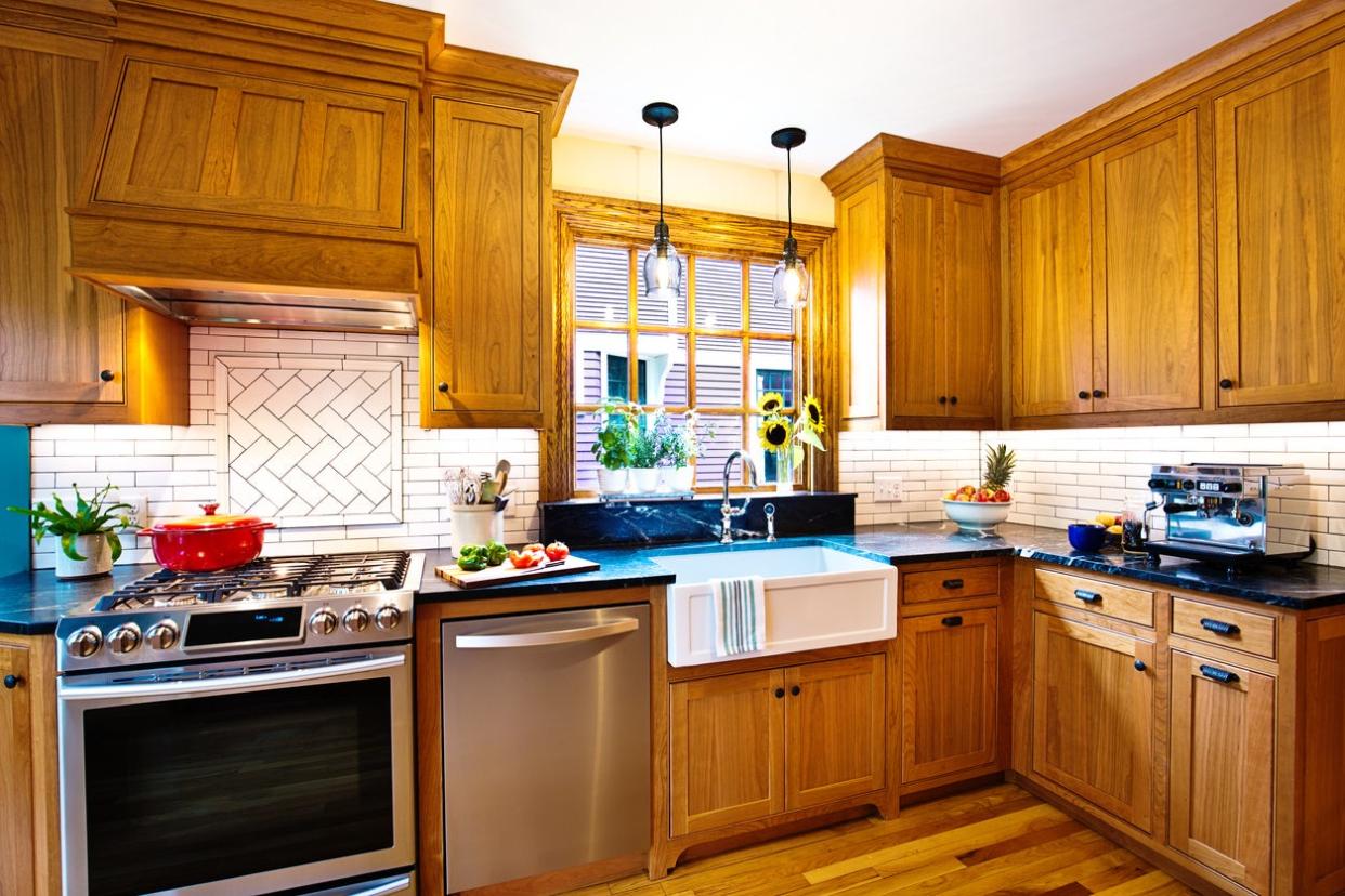 Kitchen with natural hardwood cabinets.