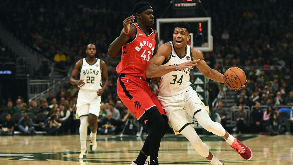 MILWAUKEE, WISCONSIN - NOVEMBER 02:  Giannis Antetokounmpo #34 of the Milwaukee Bucks is defended by Pascal Siakam #43 of the Toronto Raptors during a game at Fiserv Forum on November 02, 2019 in Milwaukee, Wisconsin. NOTE TO USER: User expressly acknowledges and agrees that, by downloading and or using this photograph, User is consenting to the terms and conditions of the Getty Images License Agreement. (Photo by Stacy Revere/Getty Images)