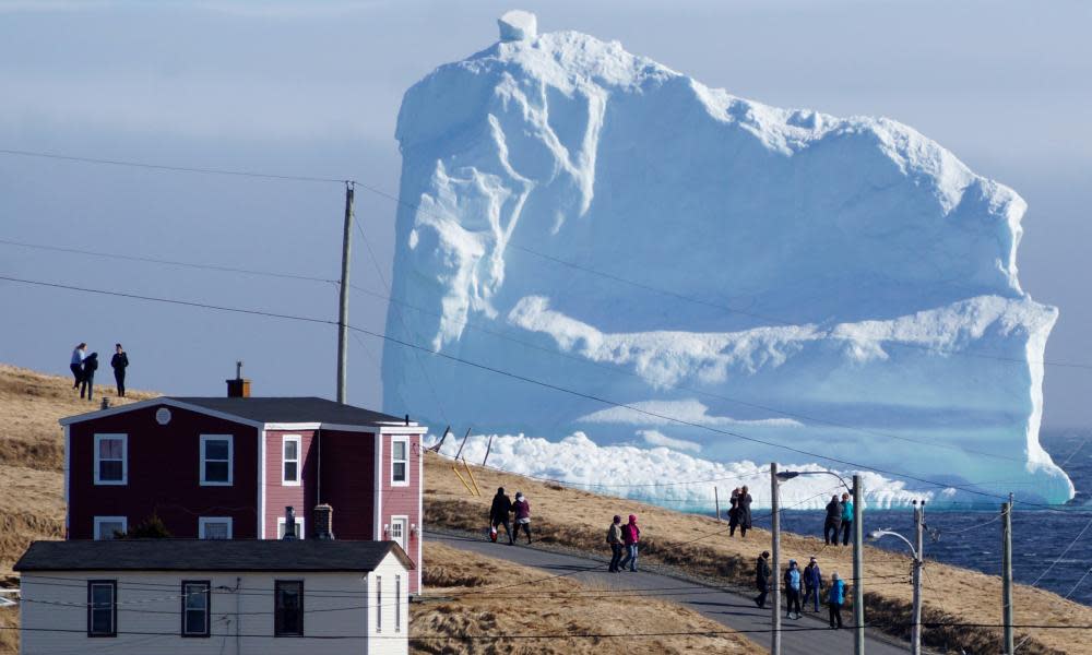 Residents view the first iceberg of the season as it passes the South Shore of Newfoundland in 2017.