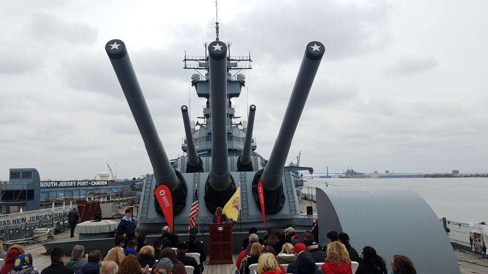 Guns of two of the main turrets of the Battleship Jersey loom over its forward deck in Camden, where the ship is moored as a museum on the Delaware River.