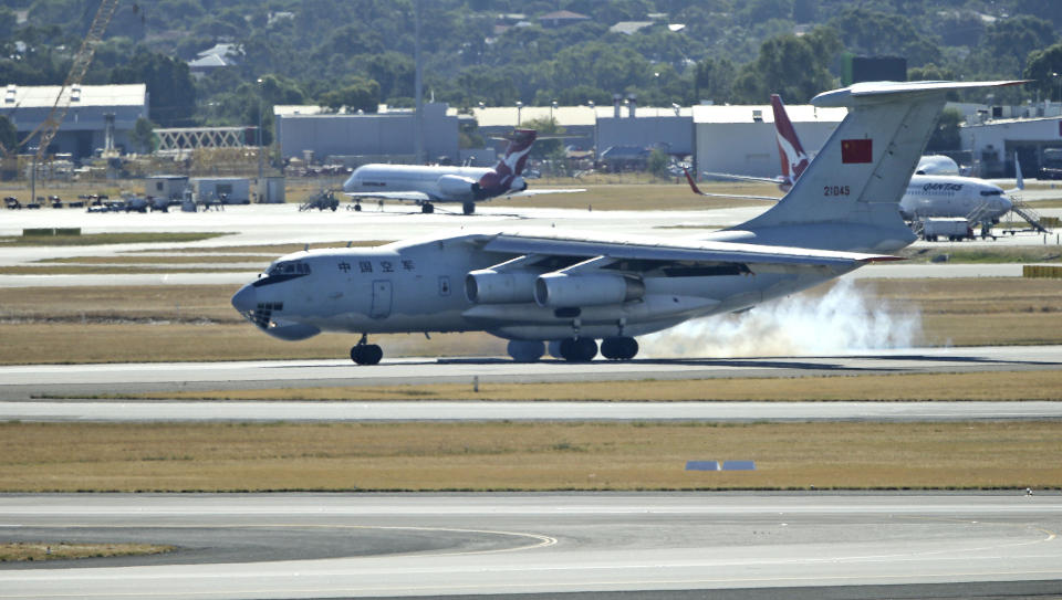 A Chinese Ilyushin IL-76s aircraft lands at Perth Airport, Australia, after returning from ongoing search operations for the missing Malaysia Airlines Flight 370, Saturday, April 12, 2014. With no new underwater signals detected, Australian Prime Minister Tony Abbott said Saturday that the massive search for the Malaysian jet would likely continue "for a long time" as electronic transmissions from the dying black boxes were fading fast. (AP Photo/Rob Griffith, Pool)