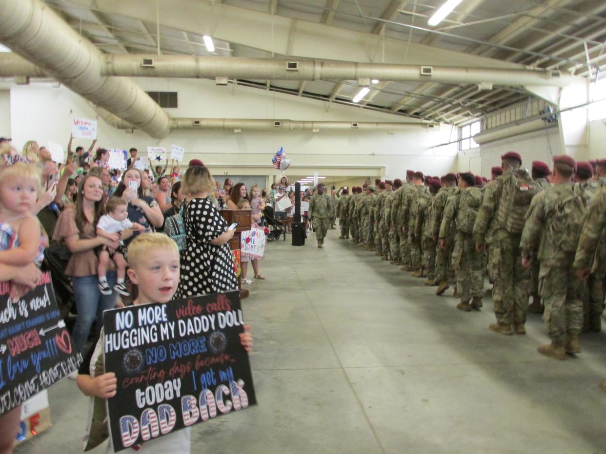 Jackson Henderson, 6, waits for his father Staff Sgt. Daniel Henderson, along with other 82nd Airborne Divison families Tuesday, June 28, 2022, at Fort Bragg's Green Ramp, as the paratroopers returned home from a deployment to Poland.