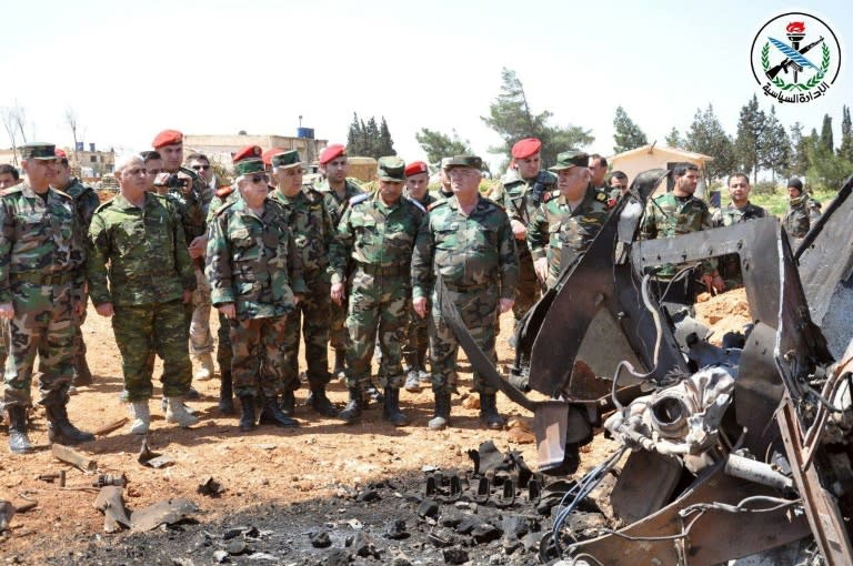 A handout picture from the Syrian Arab News Agency reportedly shows Syrian Armed Forces visiting Shayrat airfield after American forces fired a barrage of 59 cruise missiles at the airbase overnight