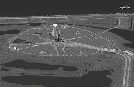 A SpaceX Falcon 9 rocket with the company's Crew Dragon spacecraft onboard at Launch Complex 39A is seen in this DigitalGlobe Satellite image at Cape Canaveral, Florida, U.S. on February 28, 2019. ©2019 DigitalGlobe, a Maxar company/Handout via REUTERS