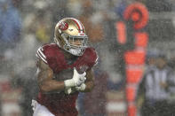 Rain falls as San Francisco 49ers running back Elijah Mitchell runs against the Indianapolis Colts during the first half of an NFL football game in Santa Clara, Calif., Sunday, Oct. 24, 2021. (AP Photo/Jed Jacobsohn)