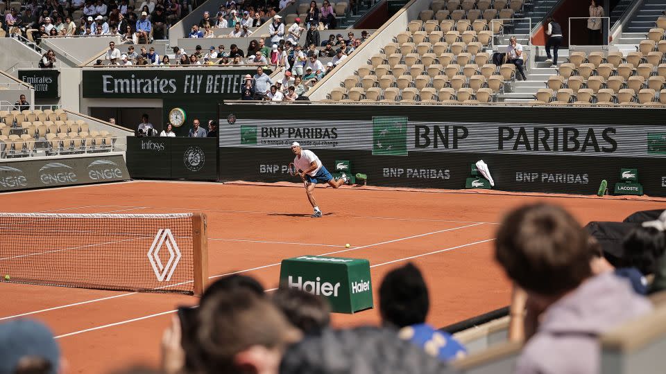 Rafael Nadal practices at Roland Garros in Paris with logos flanking the court. - Christophe Petit Tesson/EPA-EFE/Shutterstock