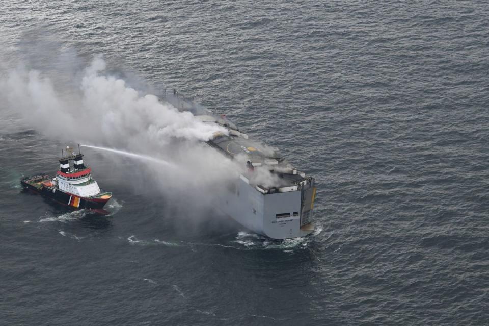 freemantle highway cargo ship fire with firefighters on scene